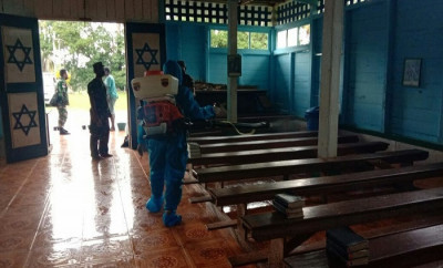 Aksi Nyata Satgas TNI Cegah Penyebaran Corona di Gereja 