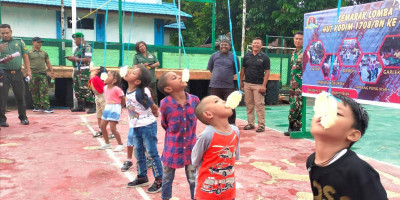 Semarak HUT Ke-54, Kodim 1708/BN Gelar Lomba Makan Kerupuk dan Goyang Daboi untuk Anak-Anak